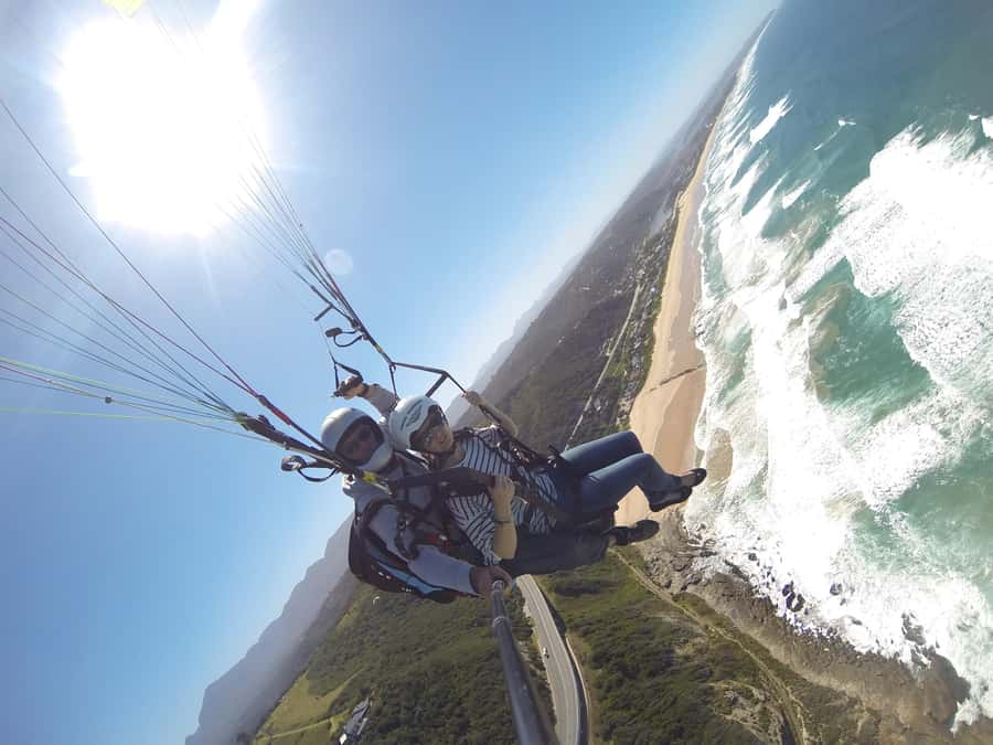 Adventure Tandem Paragliding Flight - Taking the toggles with your pilot