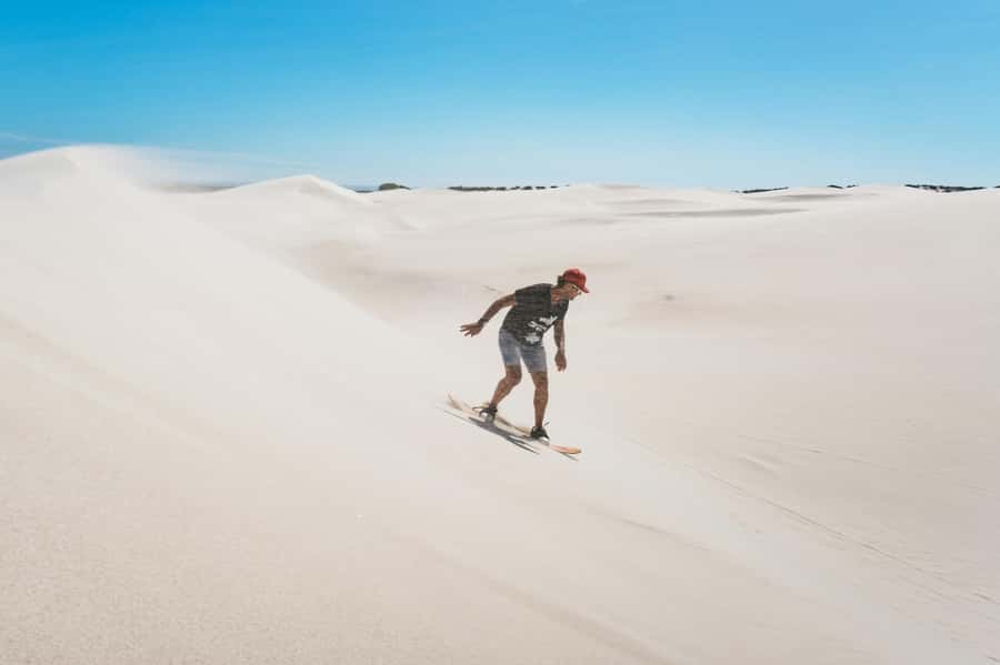 Cape Town: Atlantis White Sand Dunes Sandboarding Adventure - Riding the white dunes outside Cape Town