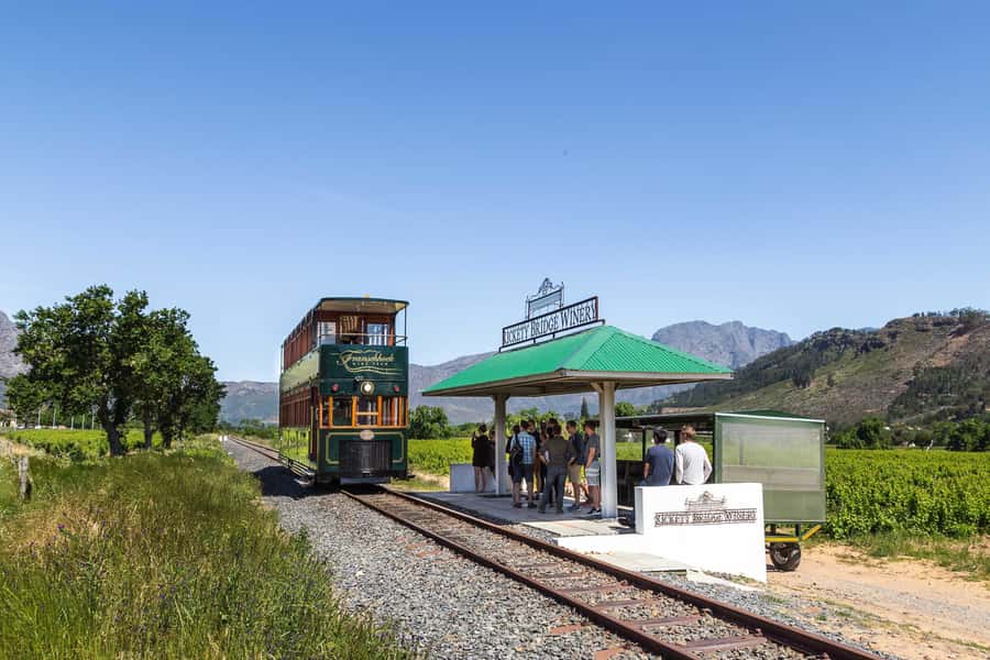 From Cape Town: Franschhoek Wine Tram Hop-on Hop-off - The coach ride turns transport into part of the day