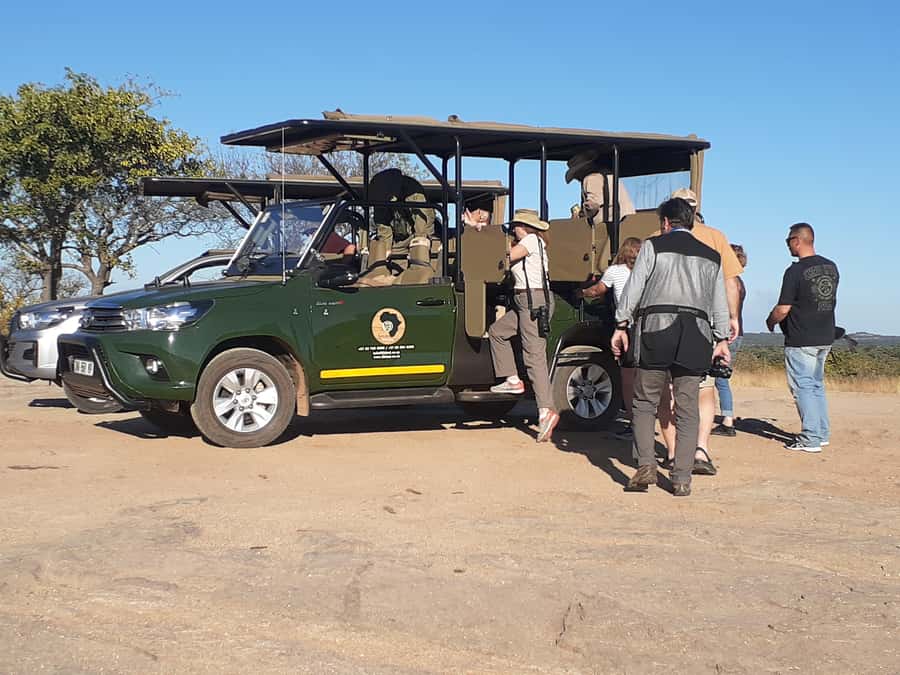 From Malelane: Half Day Kruger Park Wildlife Safari - Entering Kruger National Park by open safari vehicle