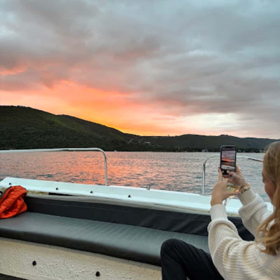 Knysna: Wine & Oyster Luxury Lounger Sunset Cruise - Cruising slowly across the Knysna Estuary