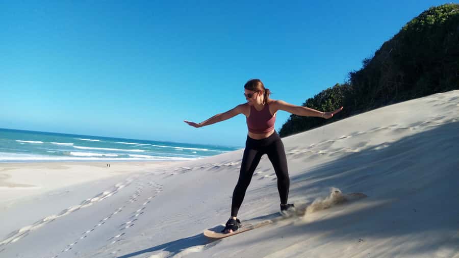 Sandboarding Jeffreys Bay - Sitting boards make this work for children