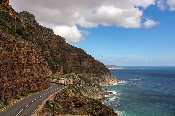 Table Mountain, Chapmans Peak Drive, Cape Point & Penguins - The return through False Bay and Muizenberg