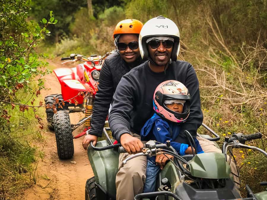 WILDERNESS GARDEN ROUTE QUAD BIKE FUN RIDE - Following the guide through trees and bushes